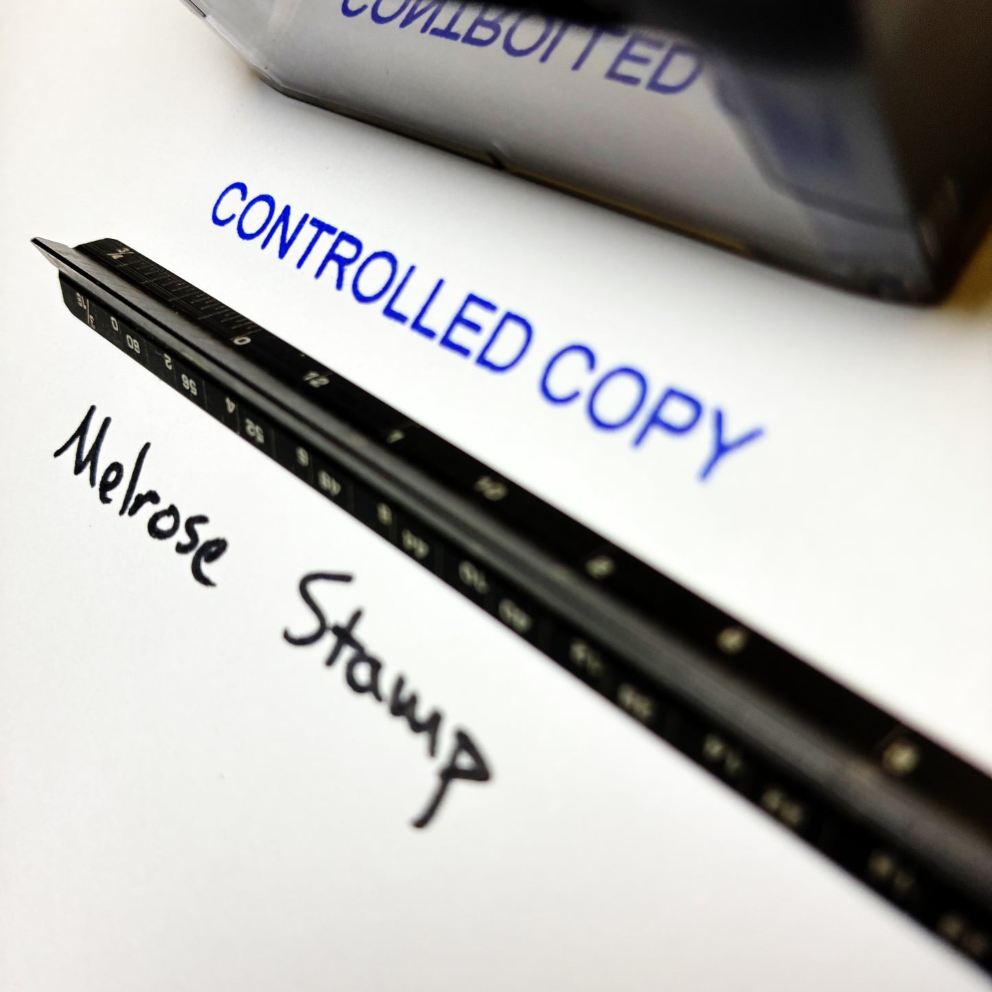Black stamp with 'Melrose Stamp' text on a white background, with 'CONTROLLED COPY' text in blue above.