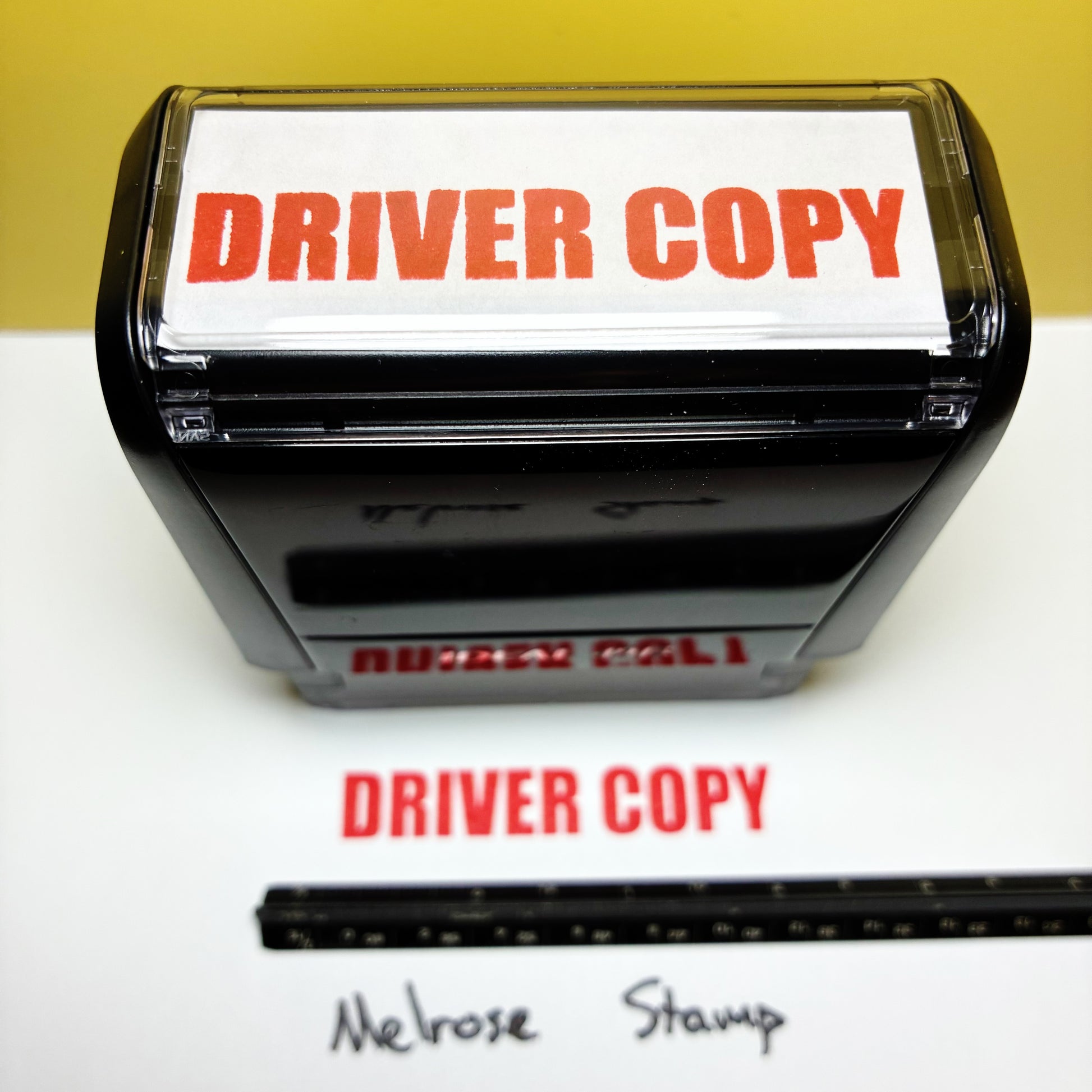 Rubber stamp with 'DRIVER COPY' text on a white background
