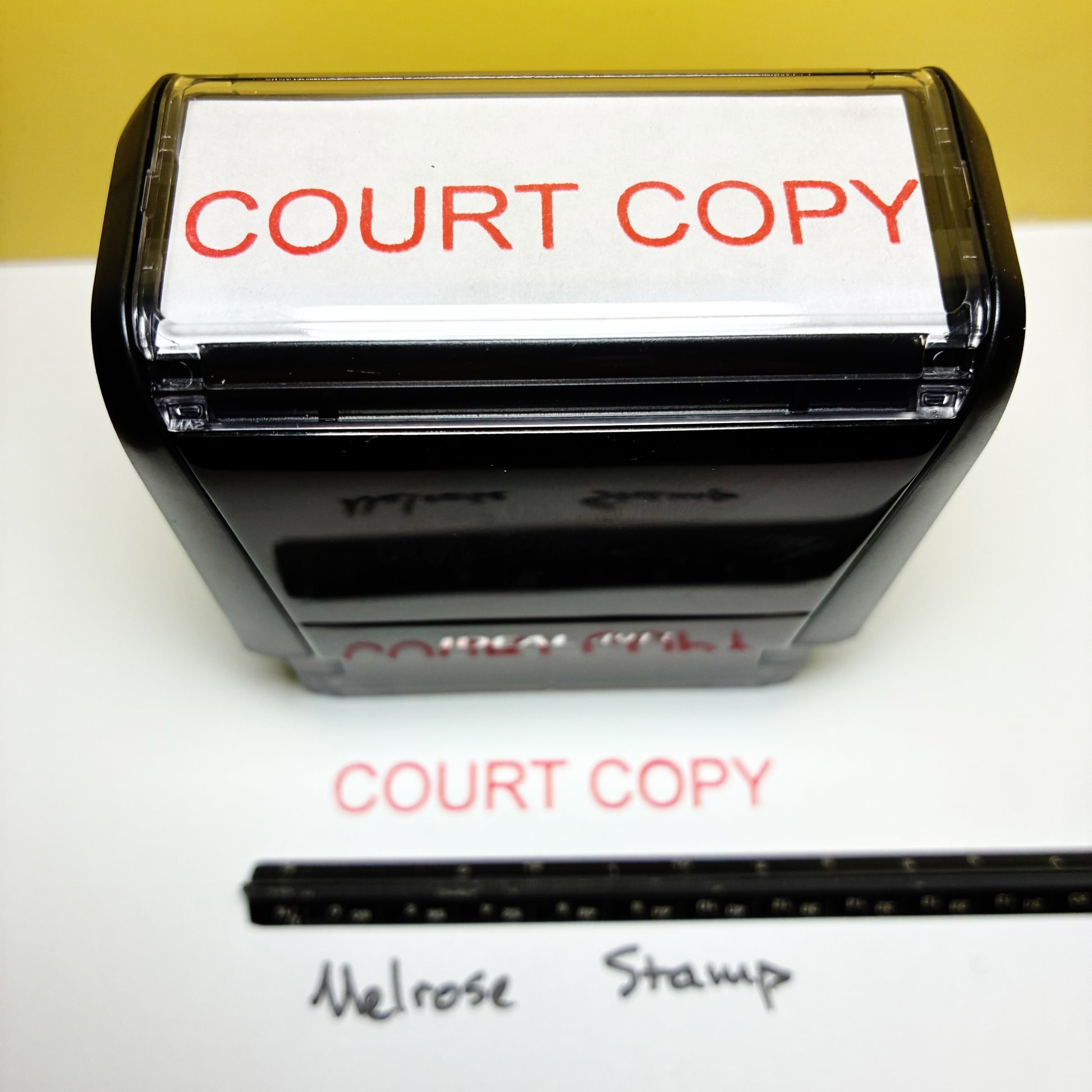 Black stamp with 'COURT COPY' text on a white background rubber stamp red ink