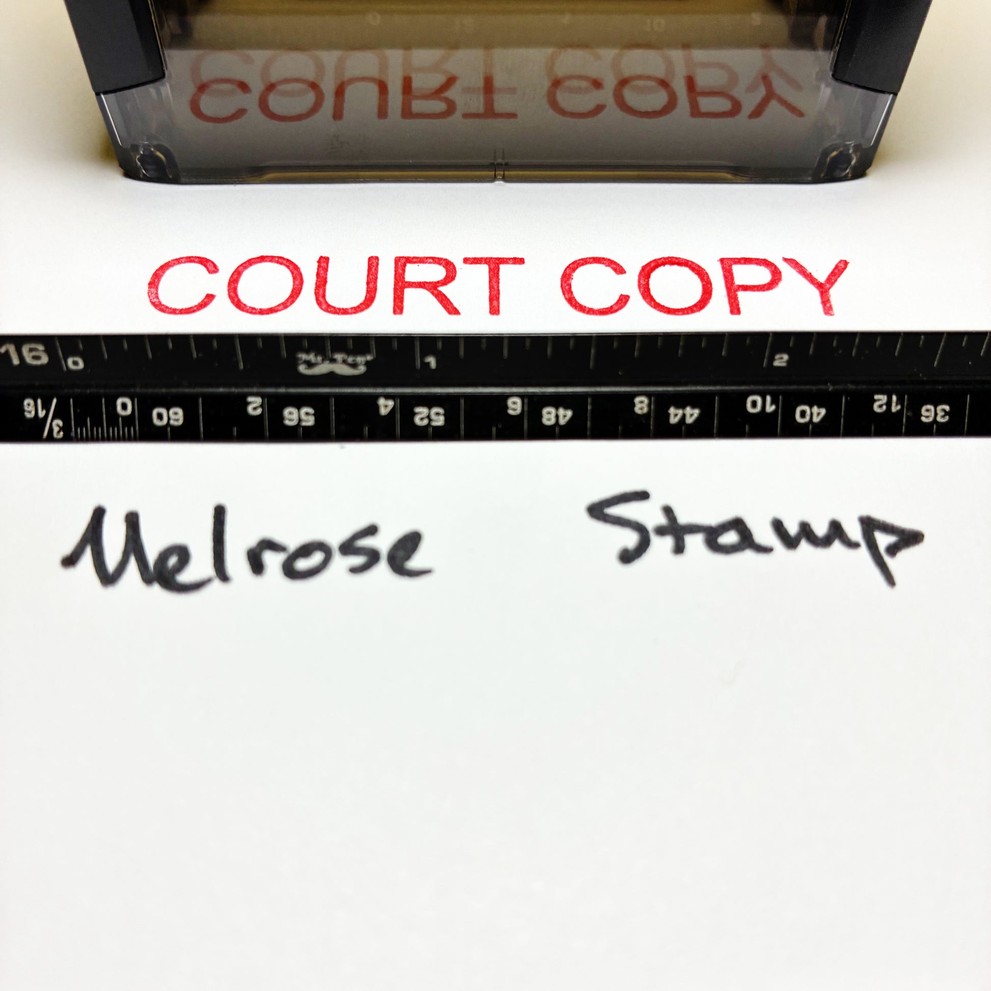 Rubber stamp with 'COURT COPY' text and a ruler below, on a white background.