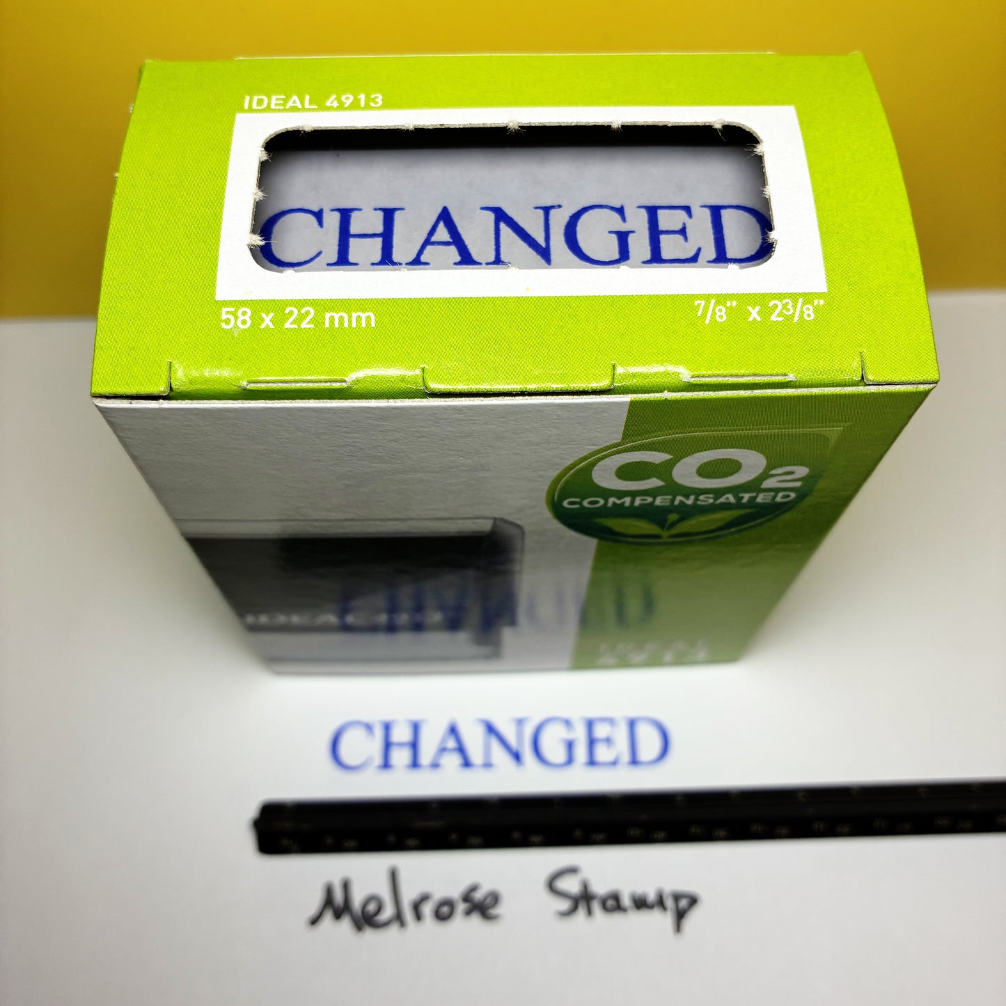Green box with 'CHANGED' rubber stamp blue ink