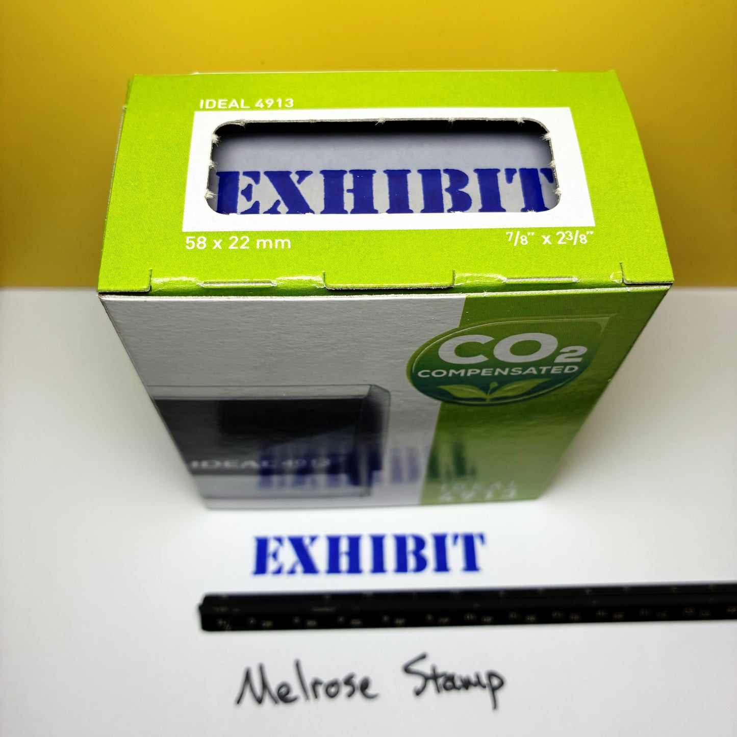 Green boxed 'Exhibit' rubber stamp with blue ink