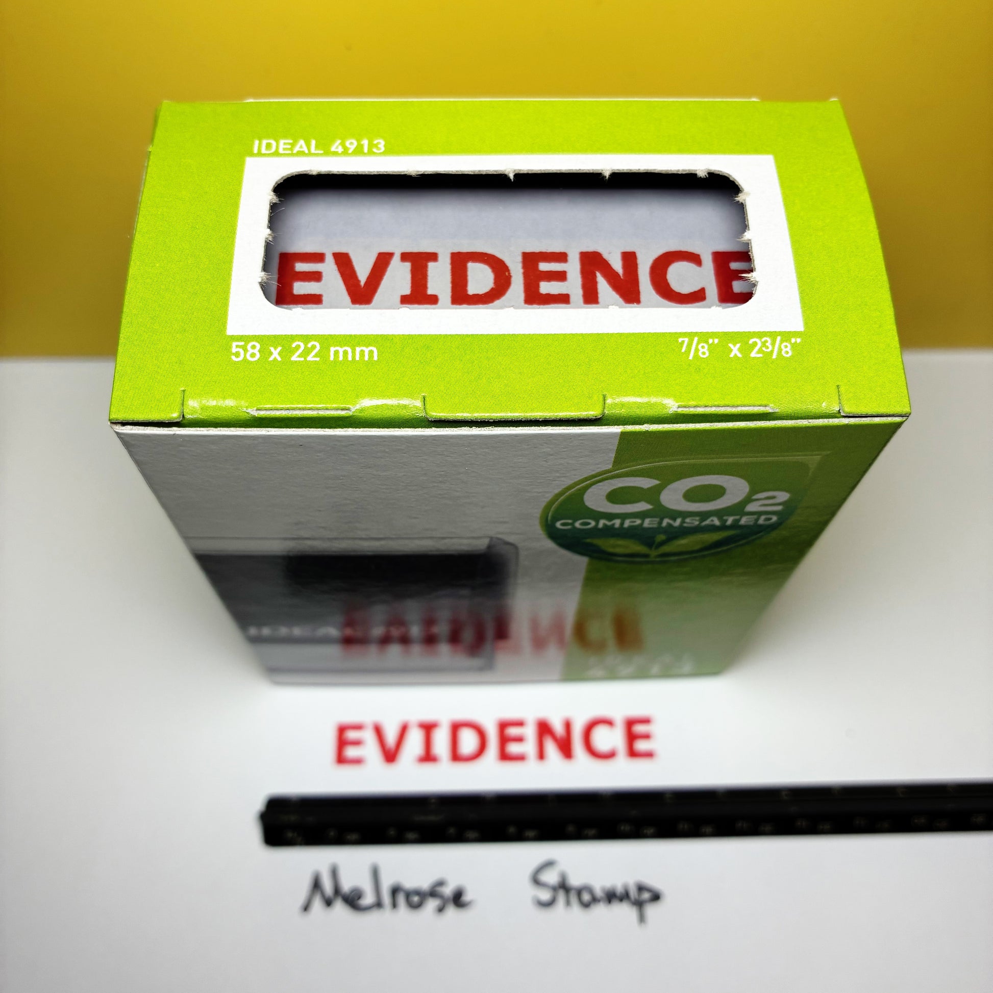 Green box 'EVIDENCE' rubber stamp with a yellow background
