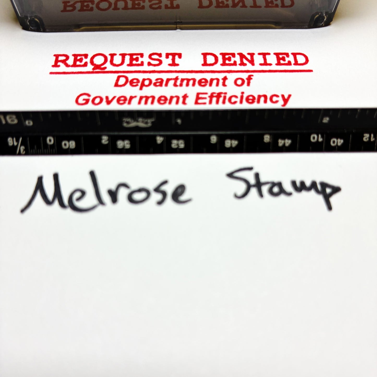 Stamp with 'REQUEST DENIED Department of Government Efficiency' text and 'Melrose Stamp' branding.