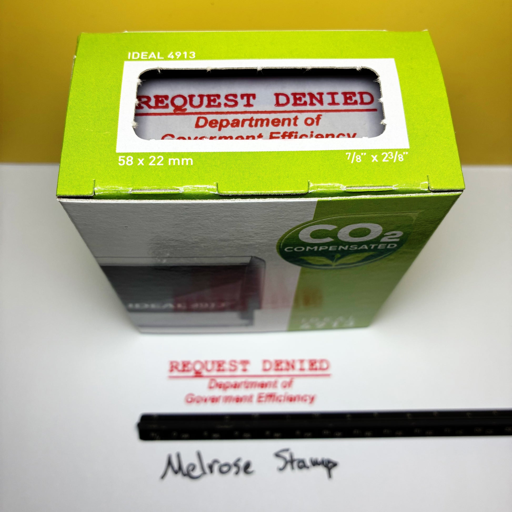 Green box with 'Request Denied Dept of Gov efficiency' stamp on a white surface