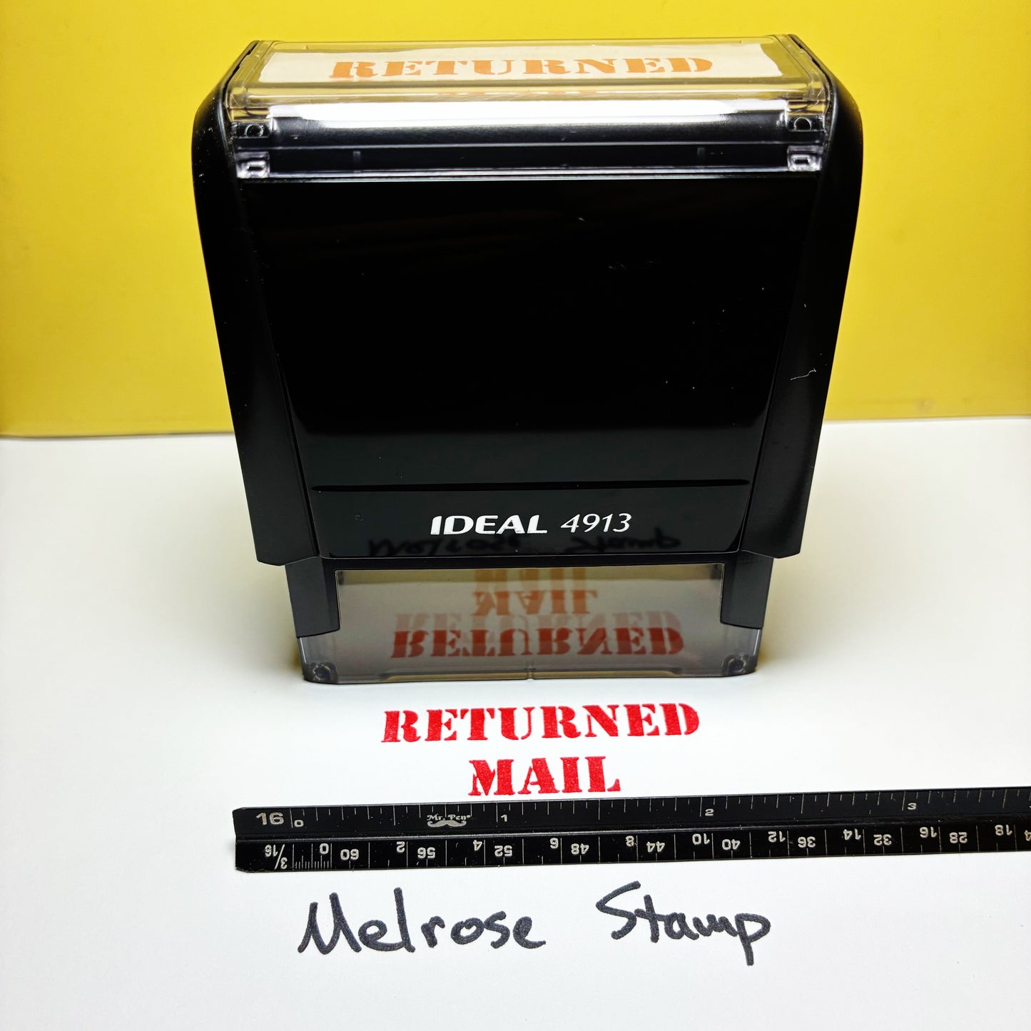 Rubber stamp with 'RETURNED MAIL' red ink self-inking large