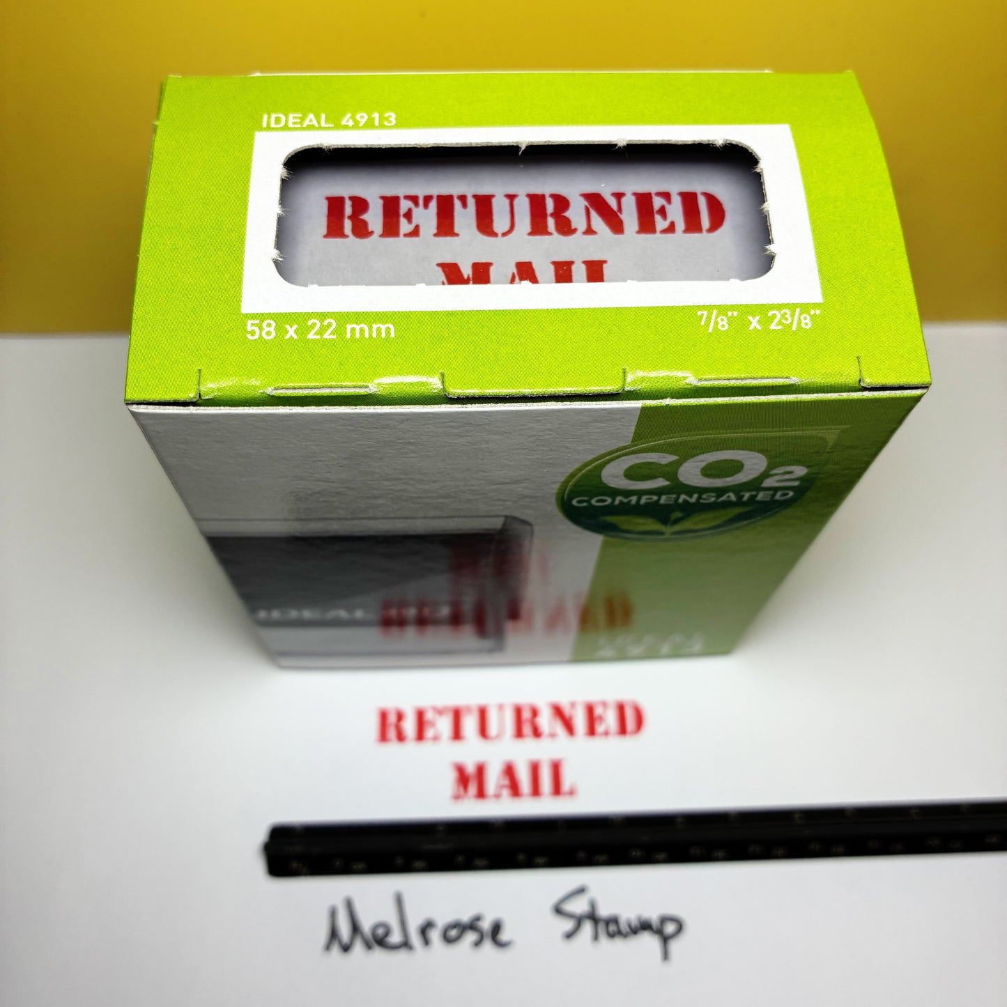 Green box 'Returned Mail' rubber stamp red ink self-inking