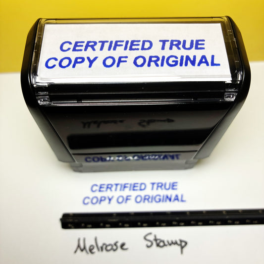 Stamp with 'CERTIFIED TRUE COPY OF ORIGINAL' text on a white surface with a yellow background.