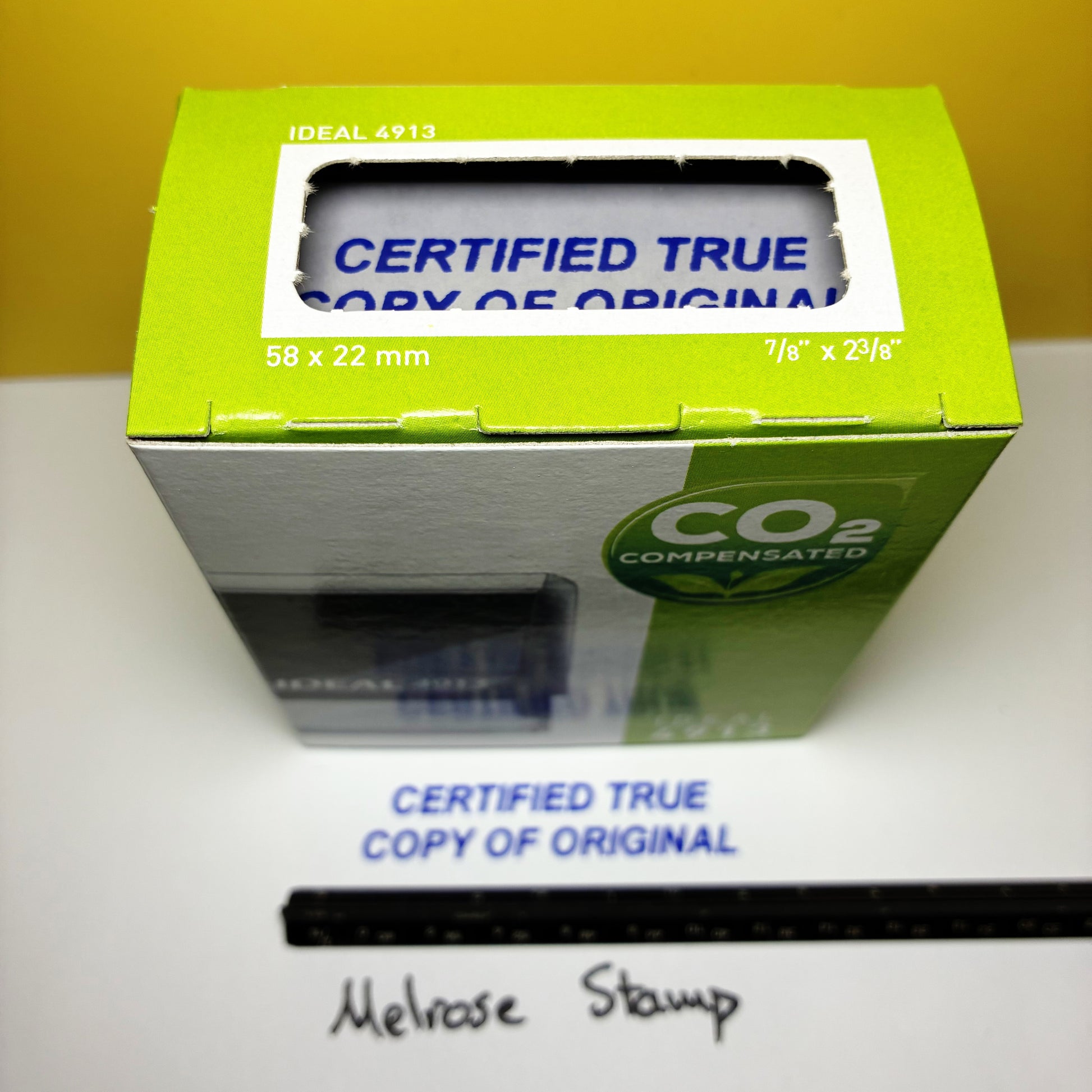 Green box with 'Certified True Copy of Original' text on a white surface.