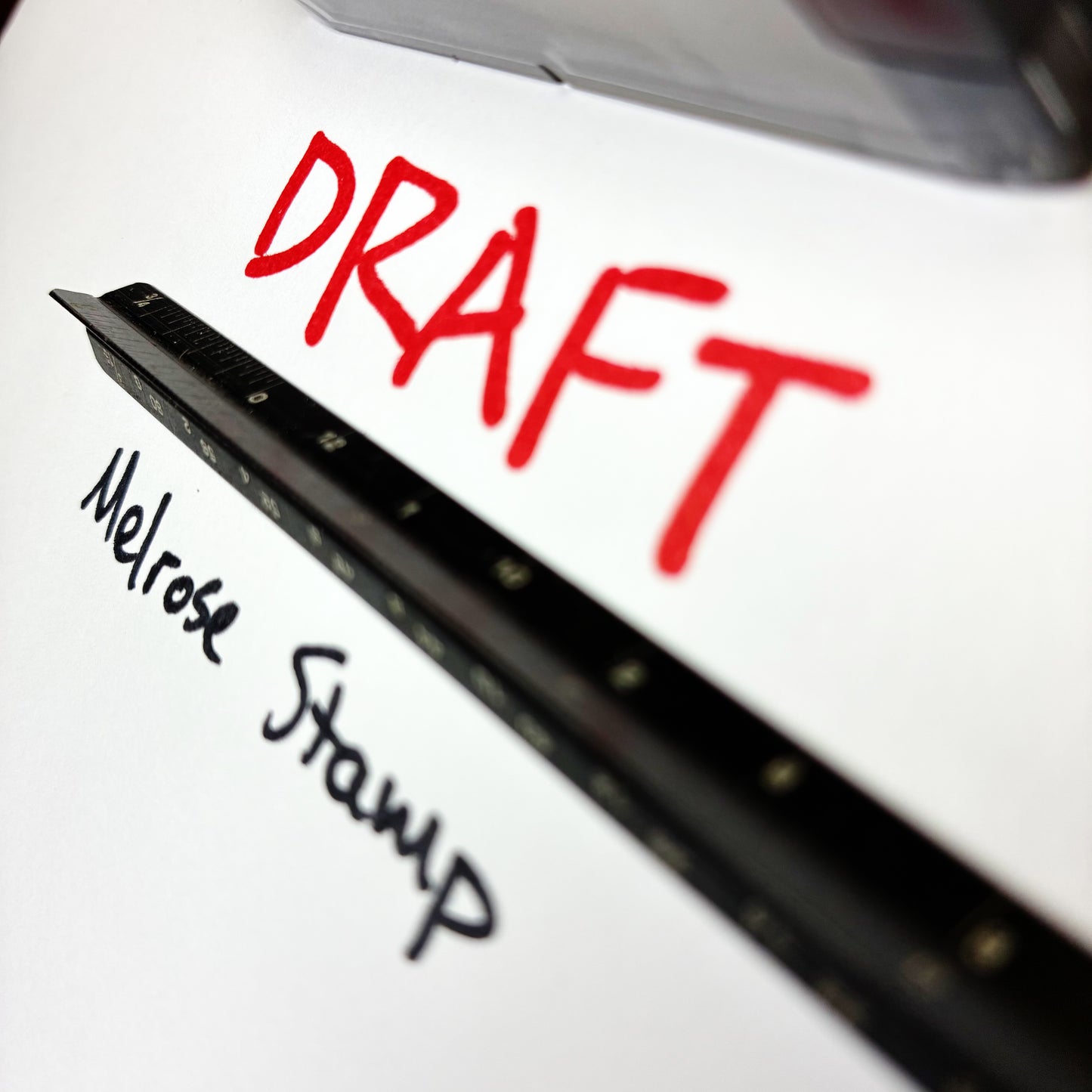 Rubber stamps with 'DRAFT' in red and 'Melrose Stamp' in black handwriting.