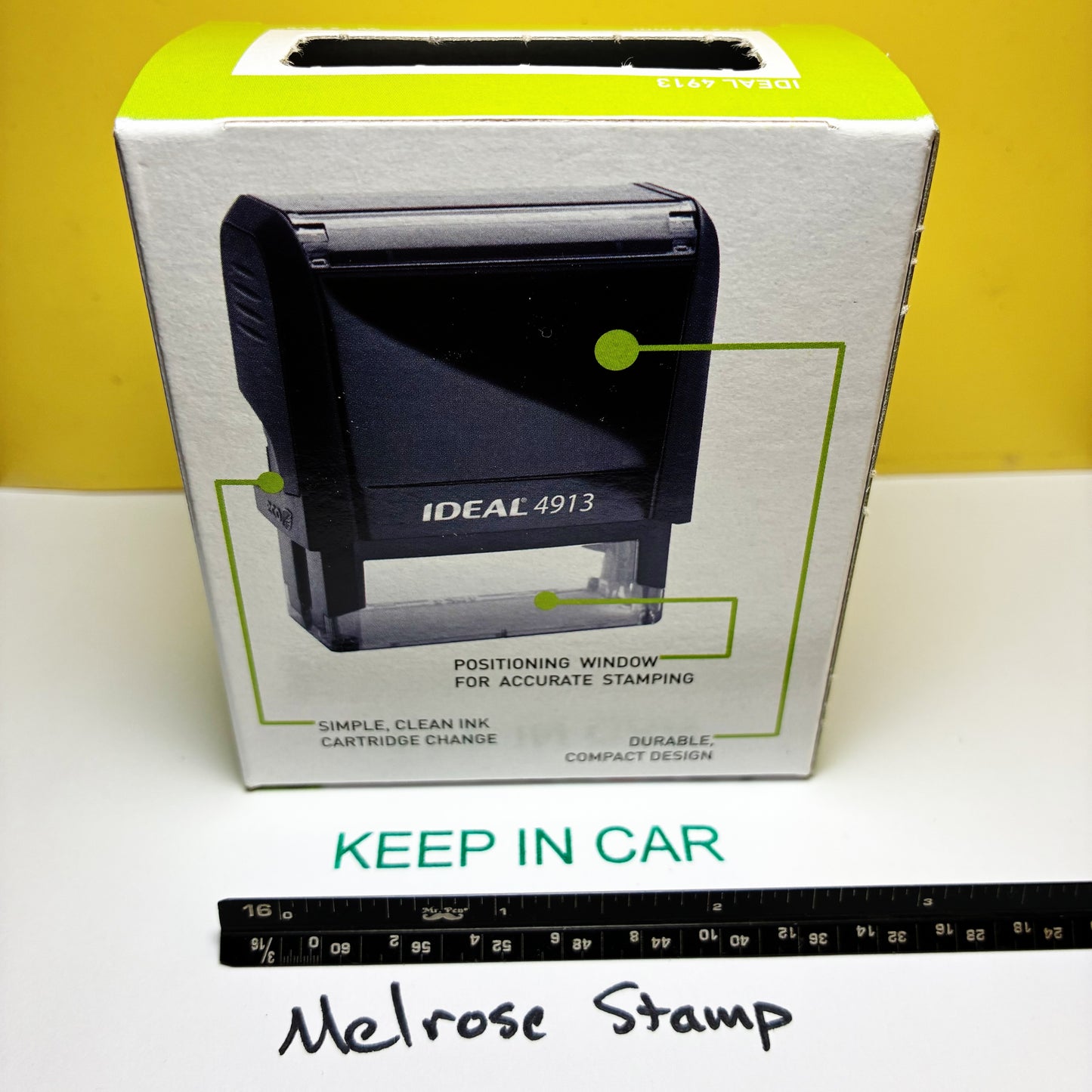 Rubber stamp Keep In Car with a ruler at the bottom