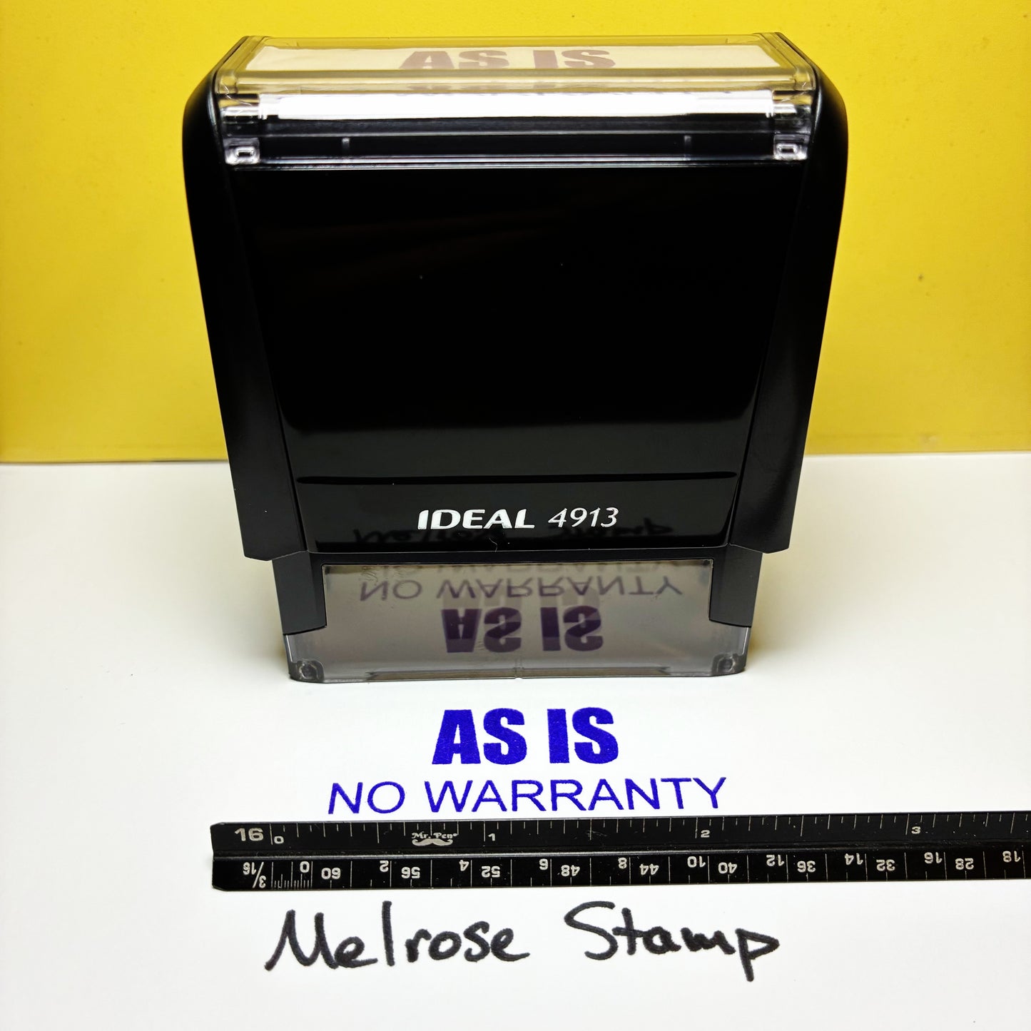 Black stamp with 'AS IS NO WARRANTY' text on a yellow and white background