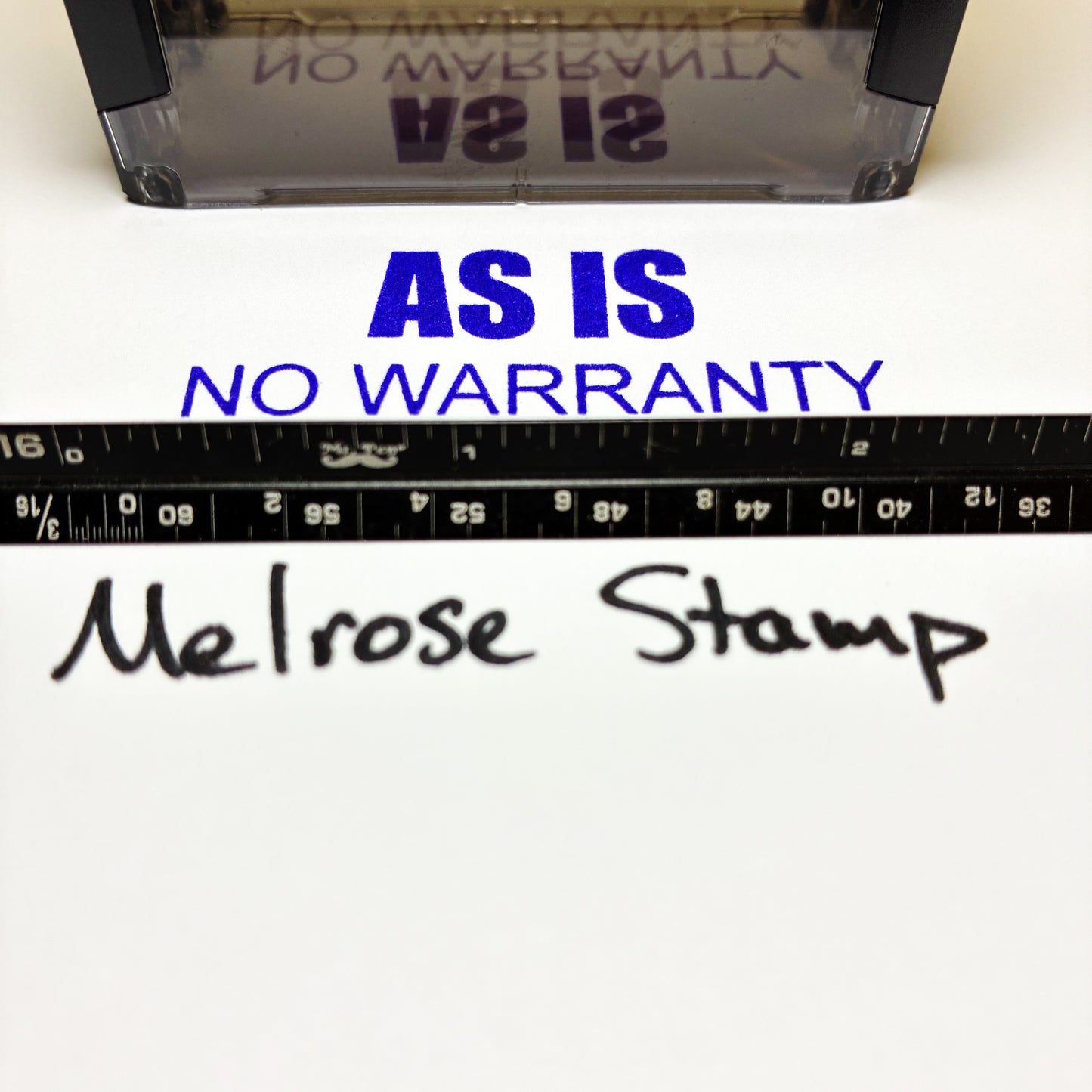Melrose Stamp with 'As Is, No Warranty' text and ruler on a white background