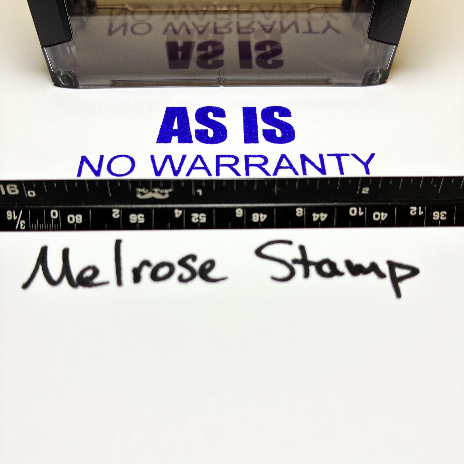 Melrose Stamp with 'As Is, No Warranty' text and ruler on a white background