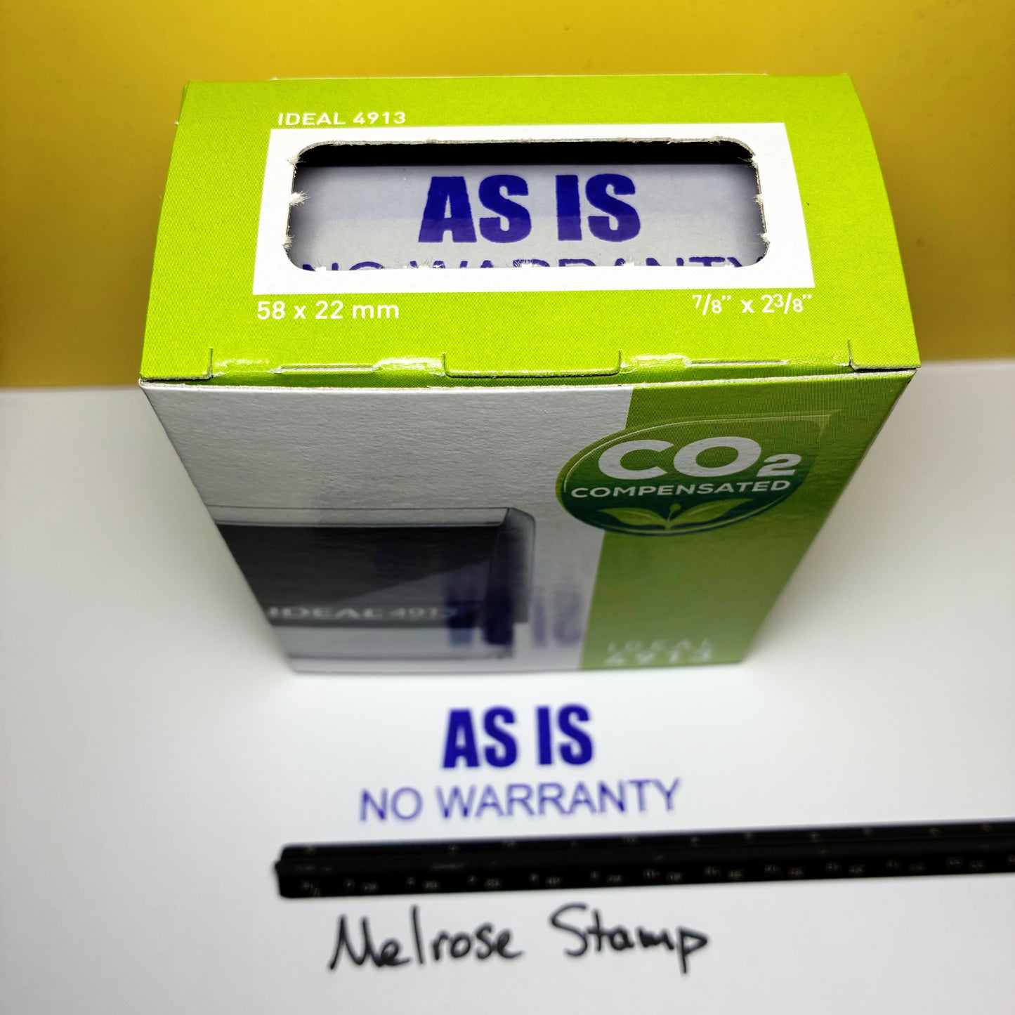 Green box with 'AS IS' label on a white surface