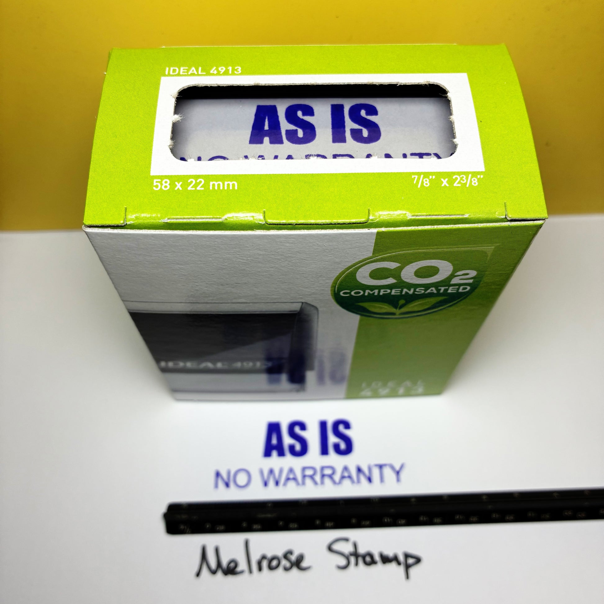 Green box with 'AS IS' label on a white surface