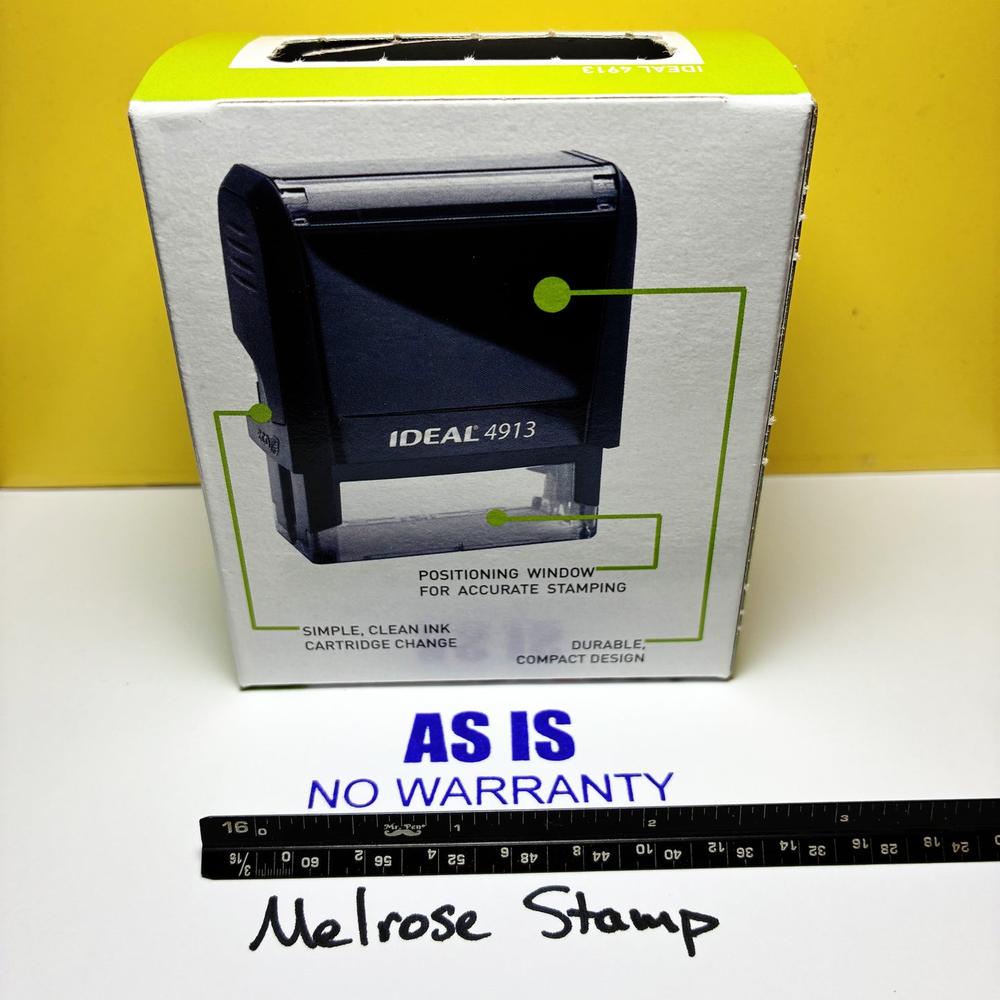 Boxed Ideal 4913 stamp on a white surface with a yellow background