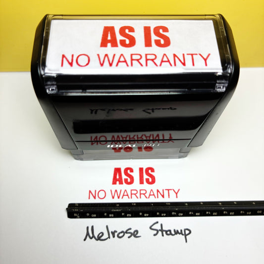 Rubber stamp with 'AS IS NO WARRANTY' text on a white surface with a yellow background.