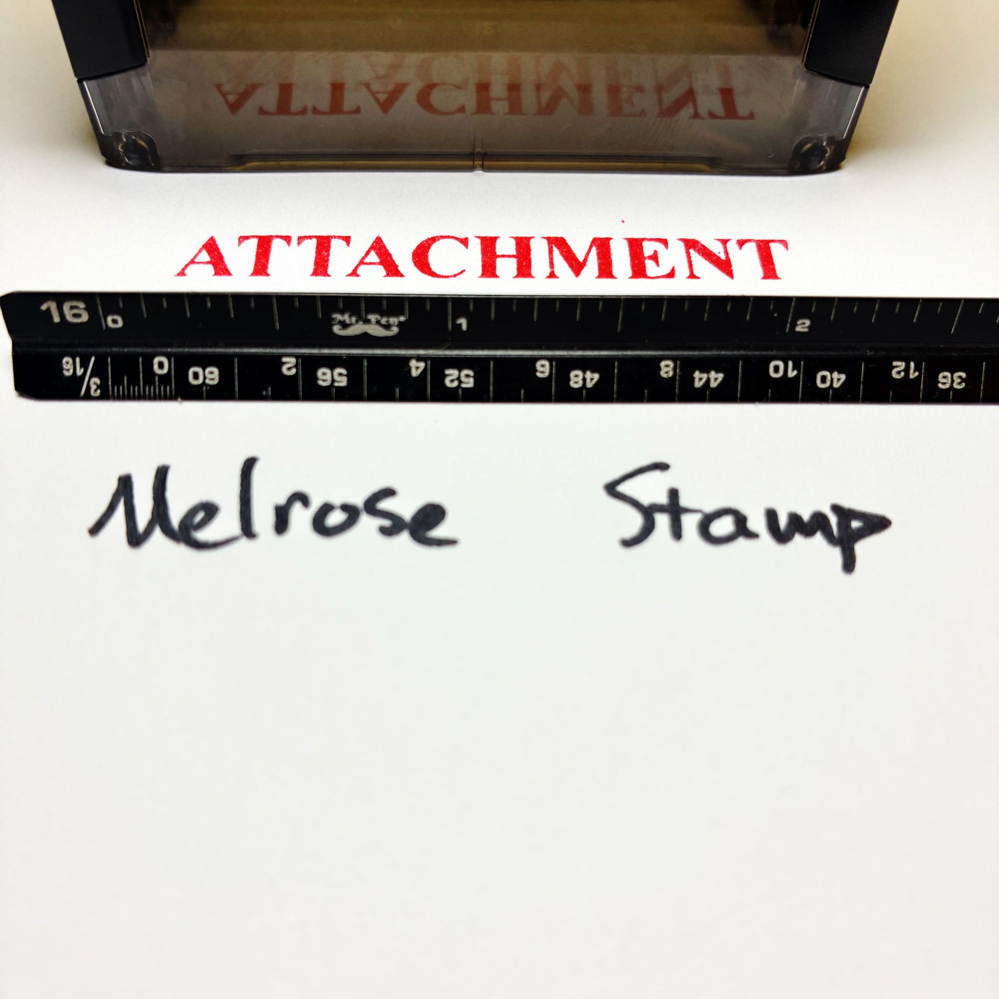 Melrose Stamp with a ruler and text on a white background with Attachment stamp.