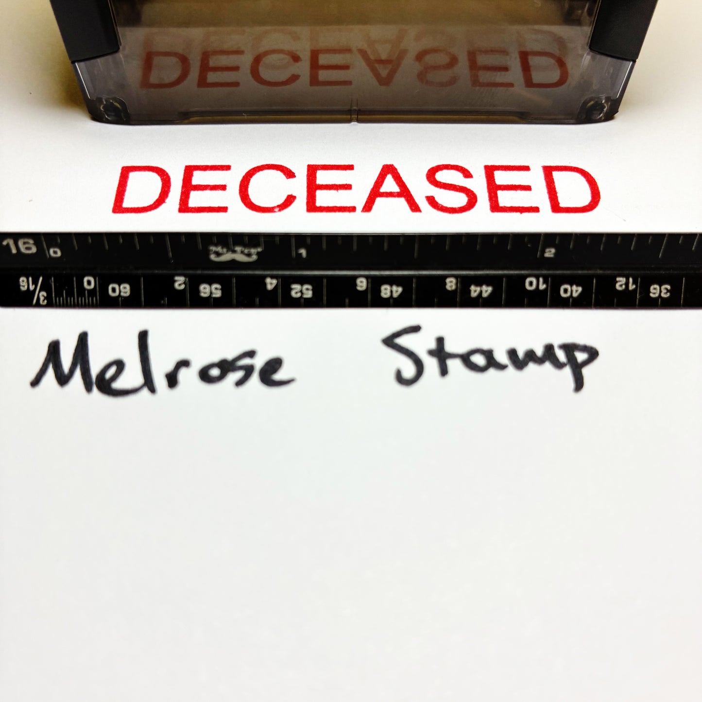Stamp with 'DECEASED' text and a ruler below, with 'Melrose Stamp' branding.