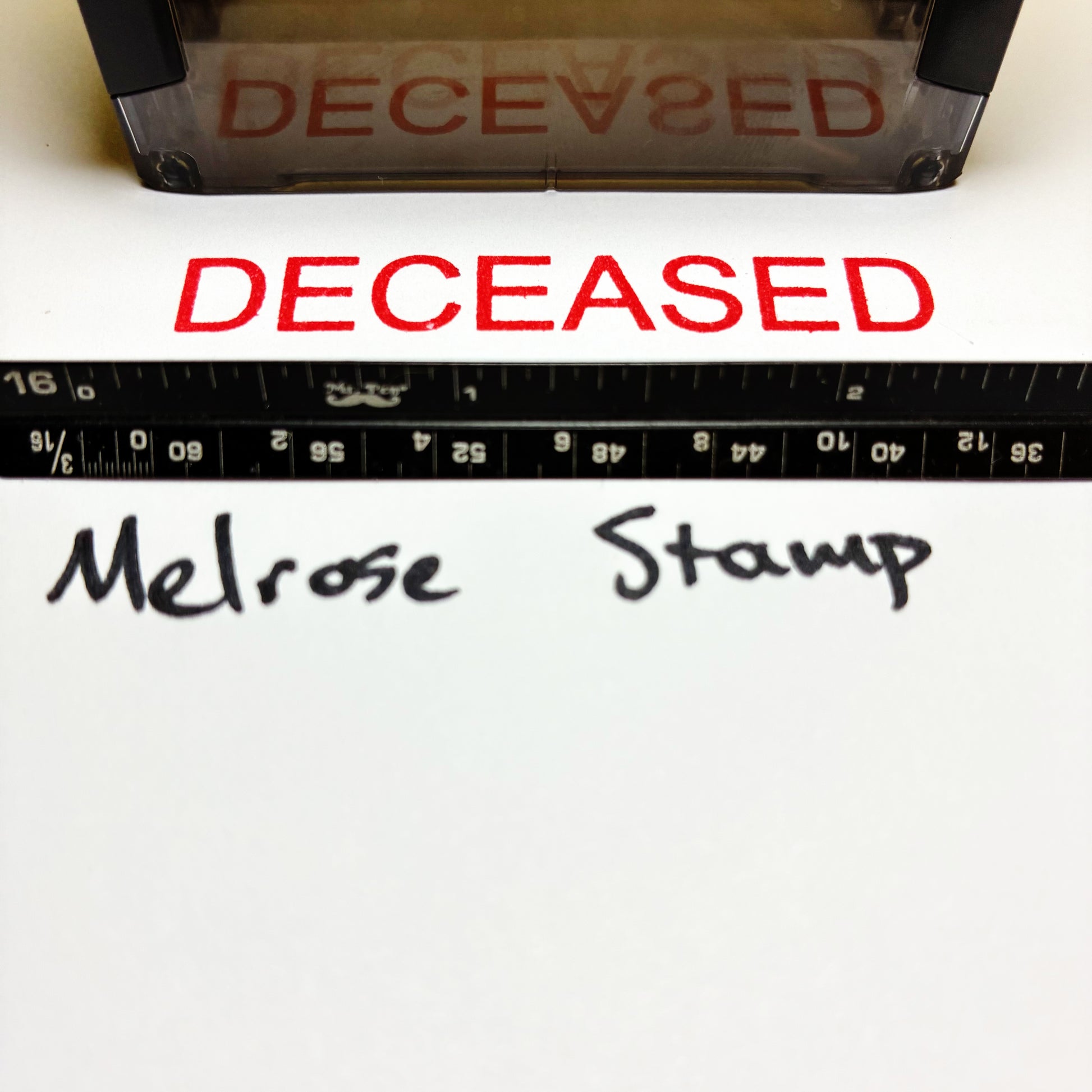 Stamp with 'DECEASED' text and a ruler below, with 'Melrose Stamp' branding.