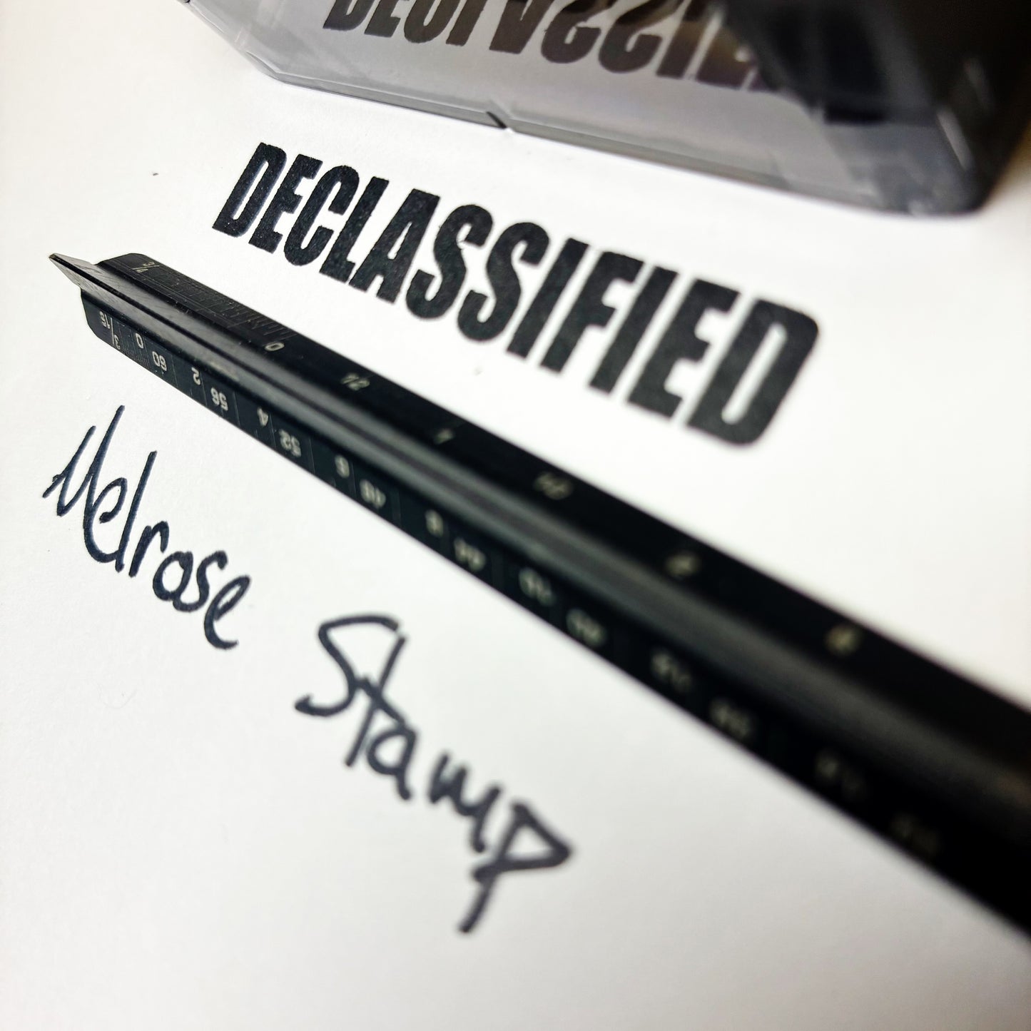 Rubber stamp with 'DECLASSIFIED' text on a white background
