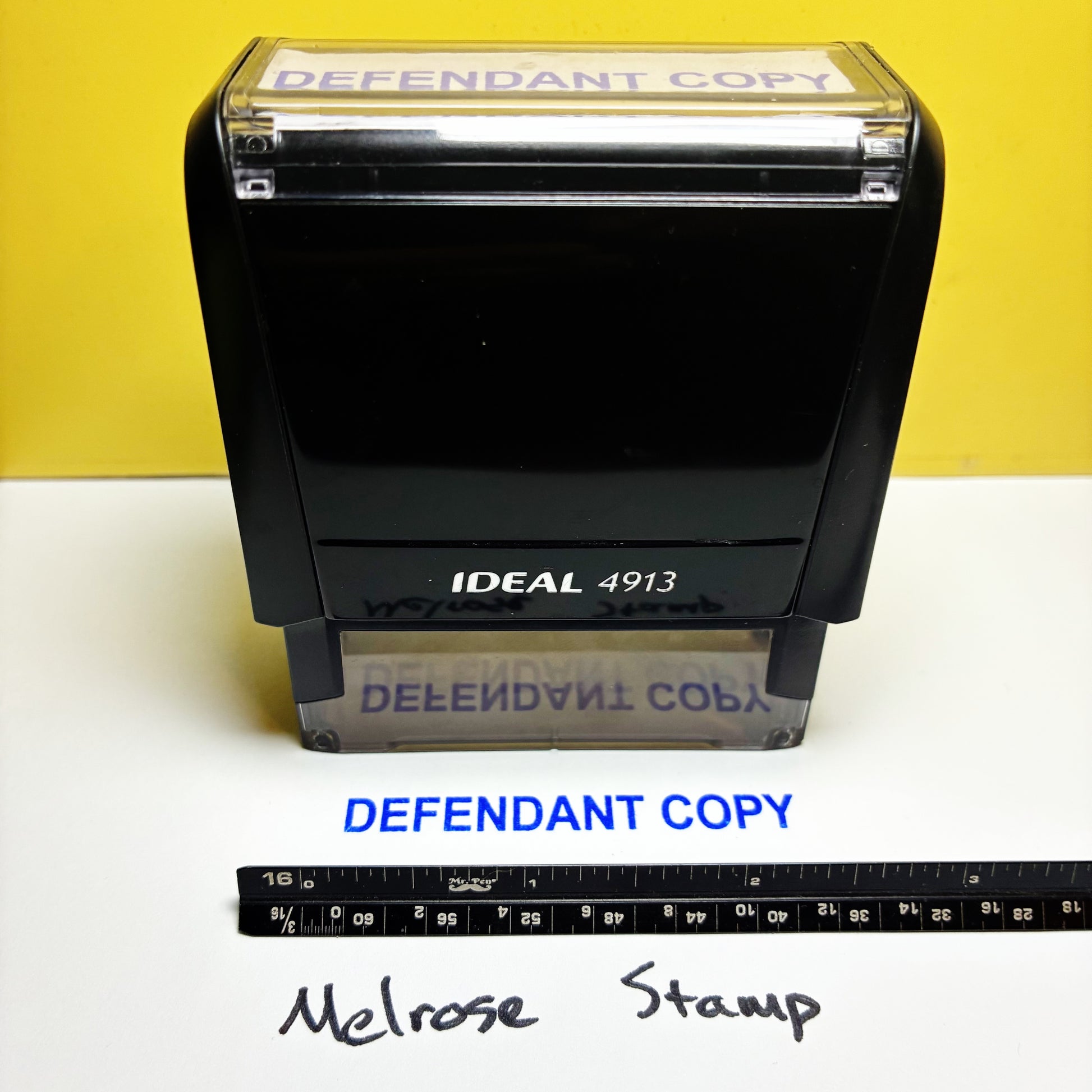 Rubber stamp with 'IDEAL 4913' on a yellow and white background, featuring 'DEFENDANT COPY' text.