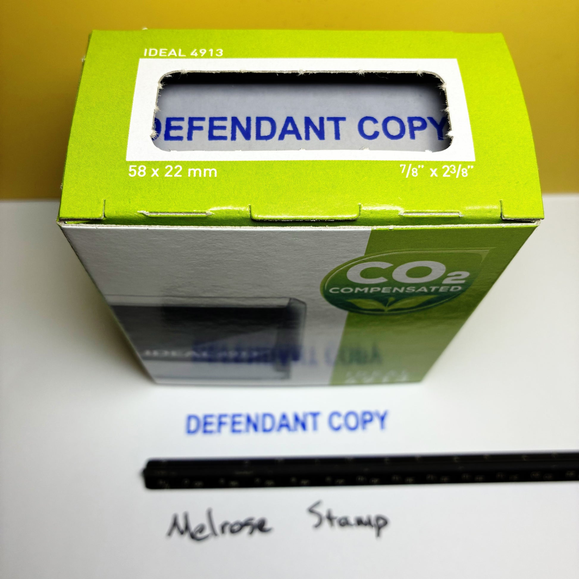 Green box with 'DEFENDANT COPY' text on a white surface