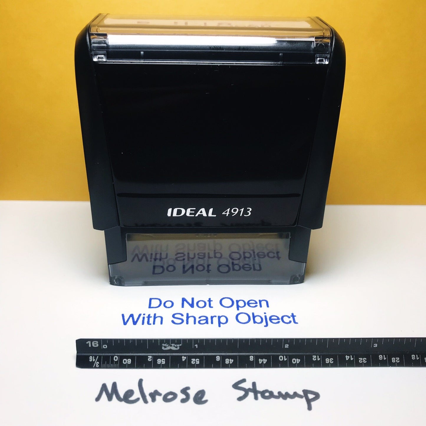 Rubber Stamp Do Not Open With Sharp Object from the front
