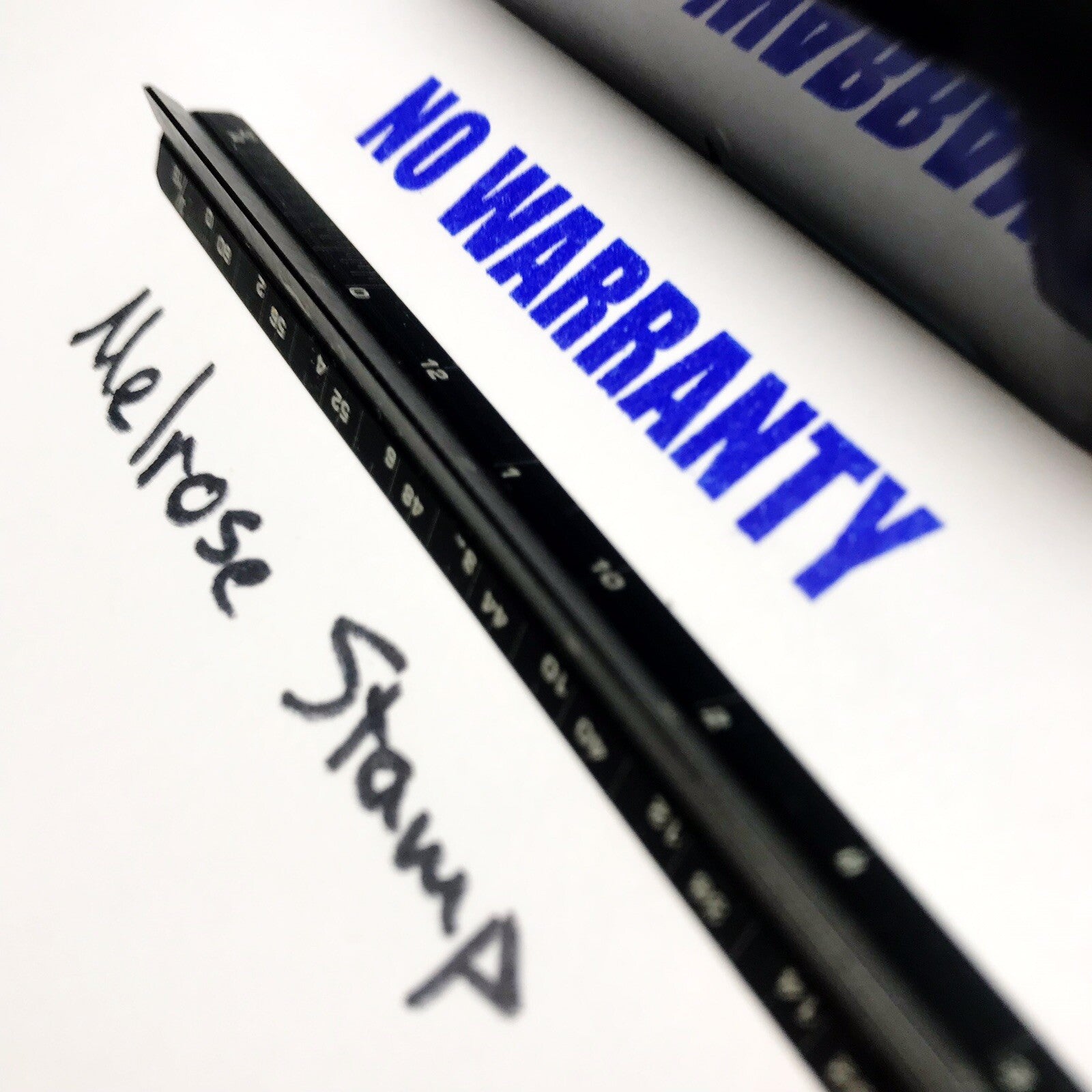 Rubber stamp with 'No Warranty' text in blue and 'Melrose Stamp' branding.