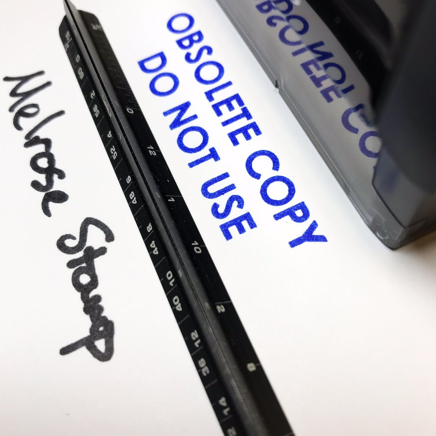 Black stamp with 'Obsolete copy do not use' text on a white background