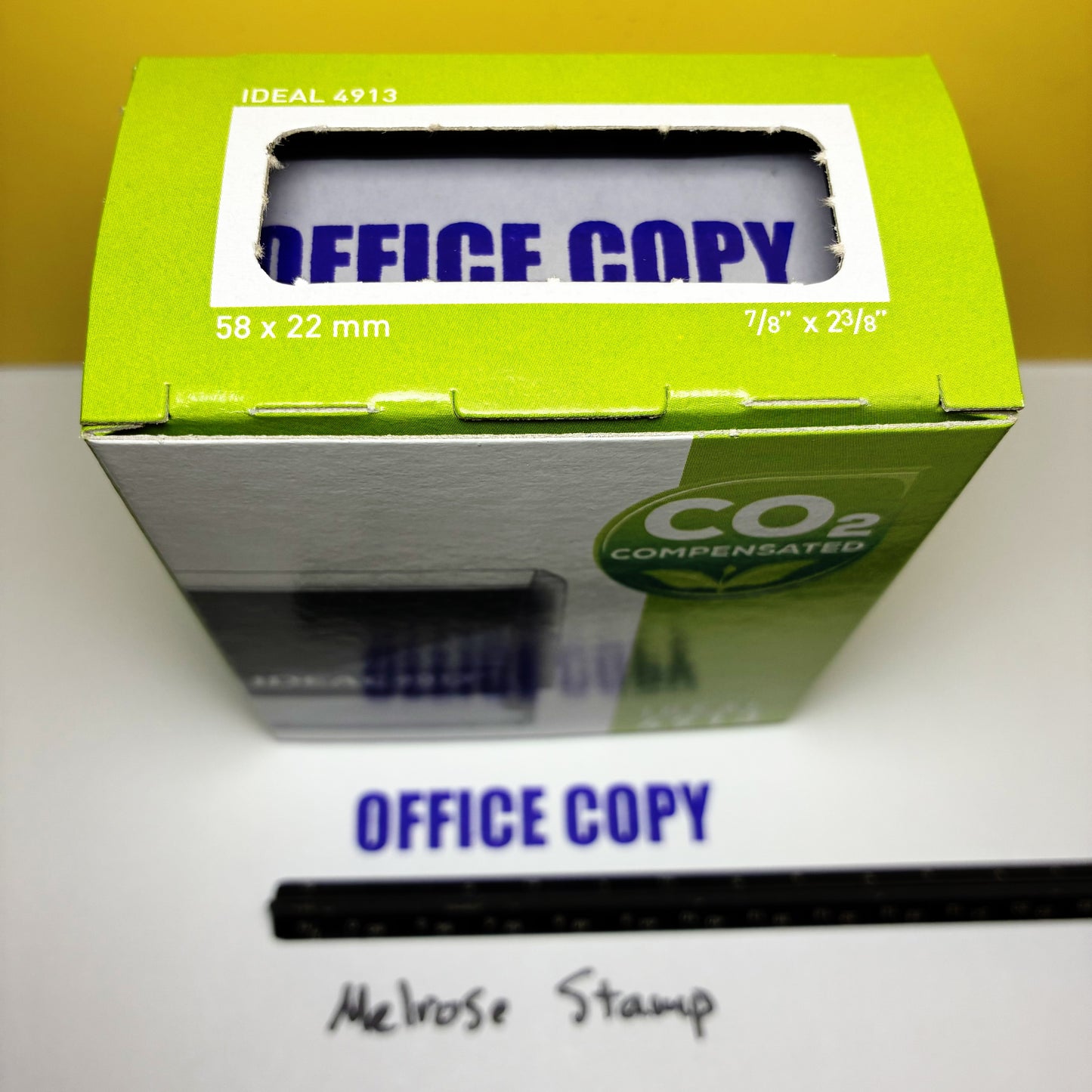 Green box labeled 'Office Copy' with a white label on a white surface.