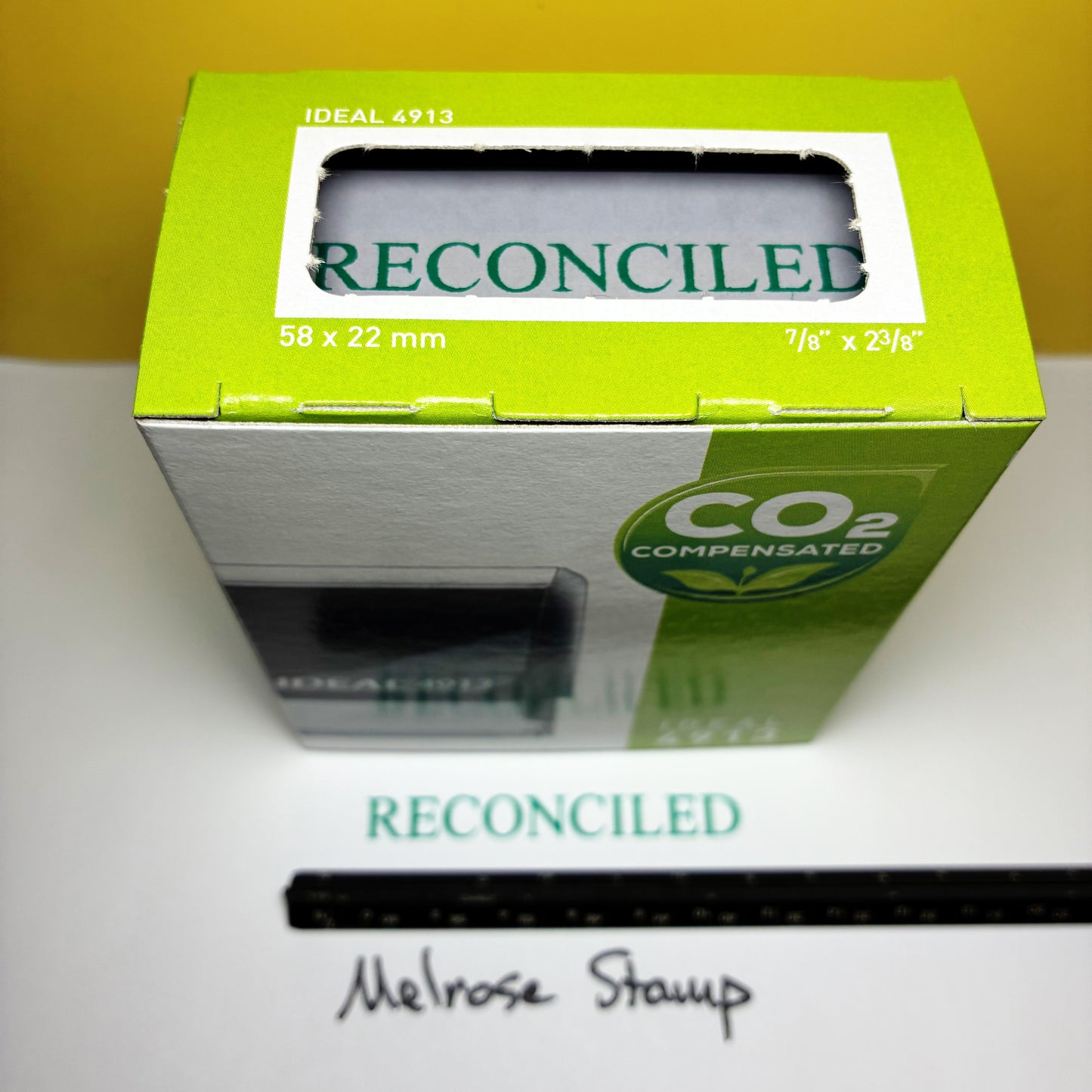 Green box labeled 'Reconciled' on a white surface.