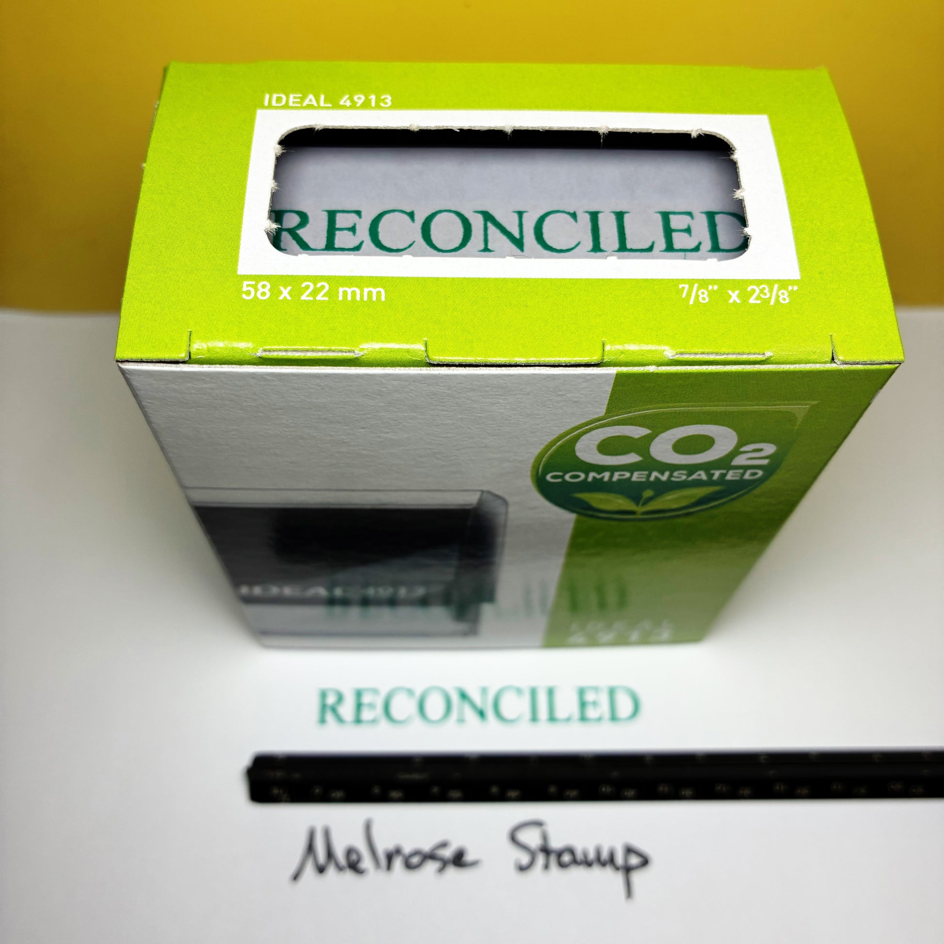 Green box labeled 'Reconciled' on a white surface.