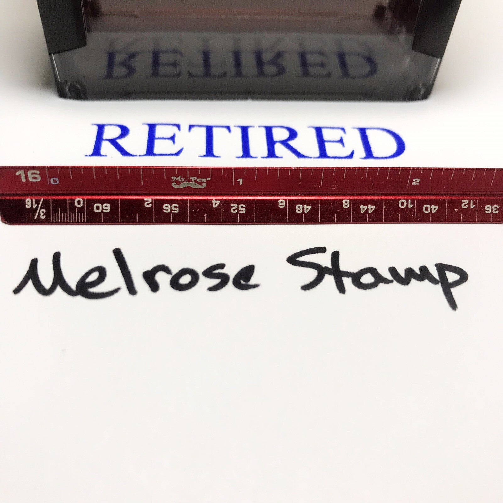Retired stamp impression with handwritten Melrose Stamp