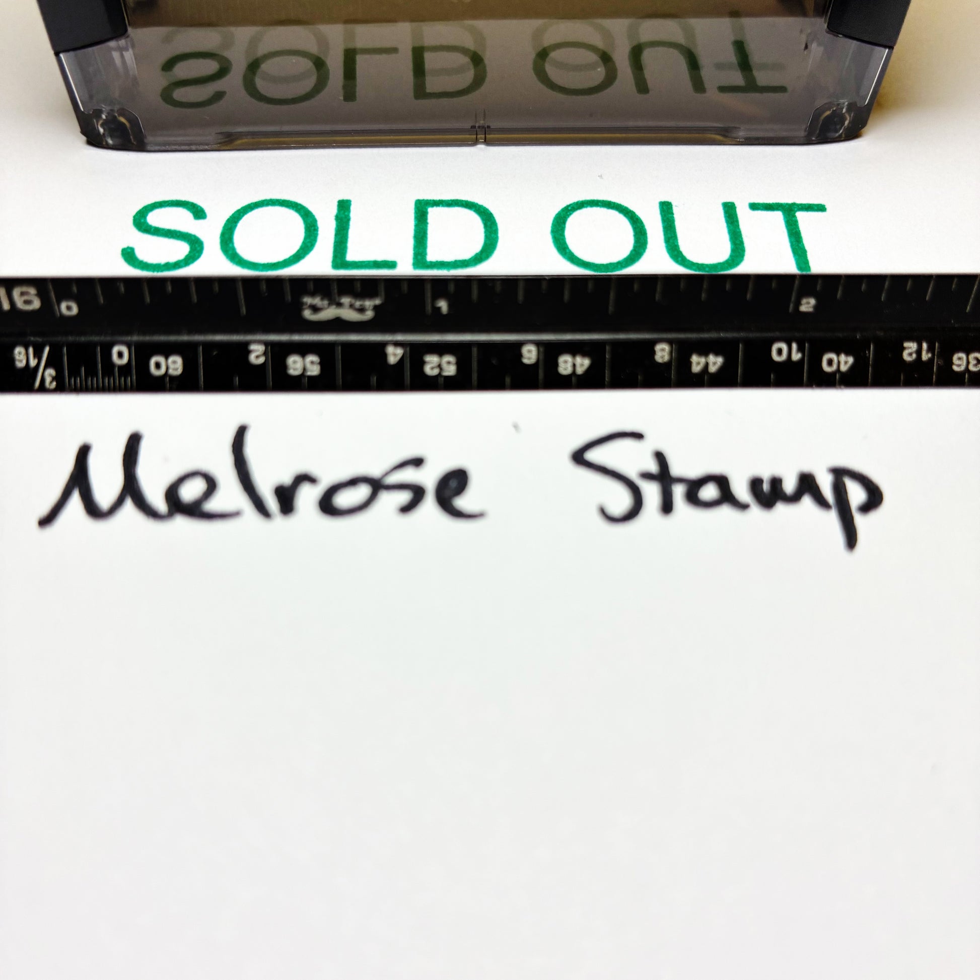 Melrose Stamp with 'SOLD OUT' text and ruler on a white background