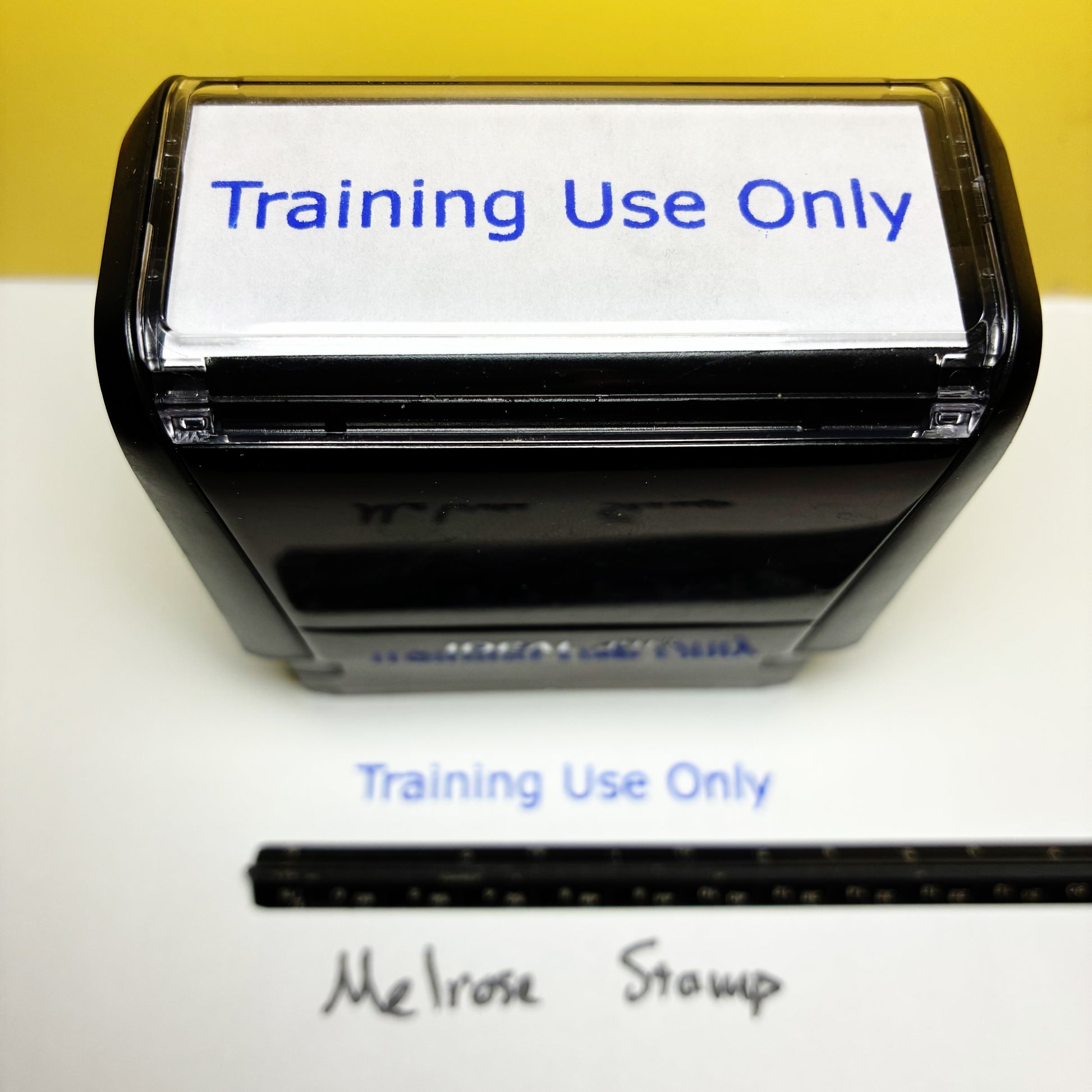 Black stamp with 'Training Use Only' text on a white background