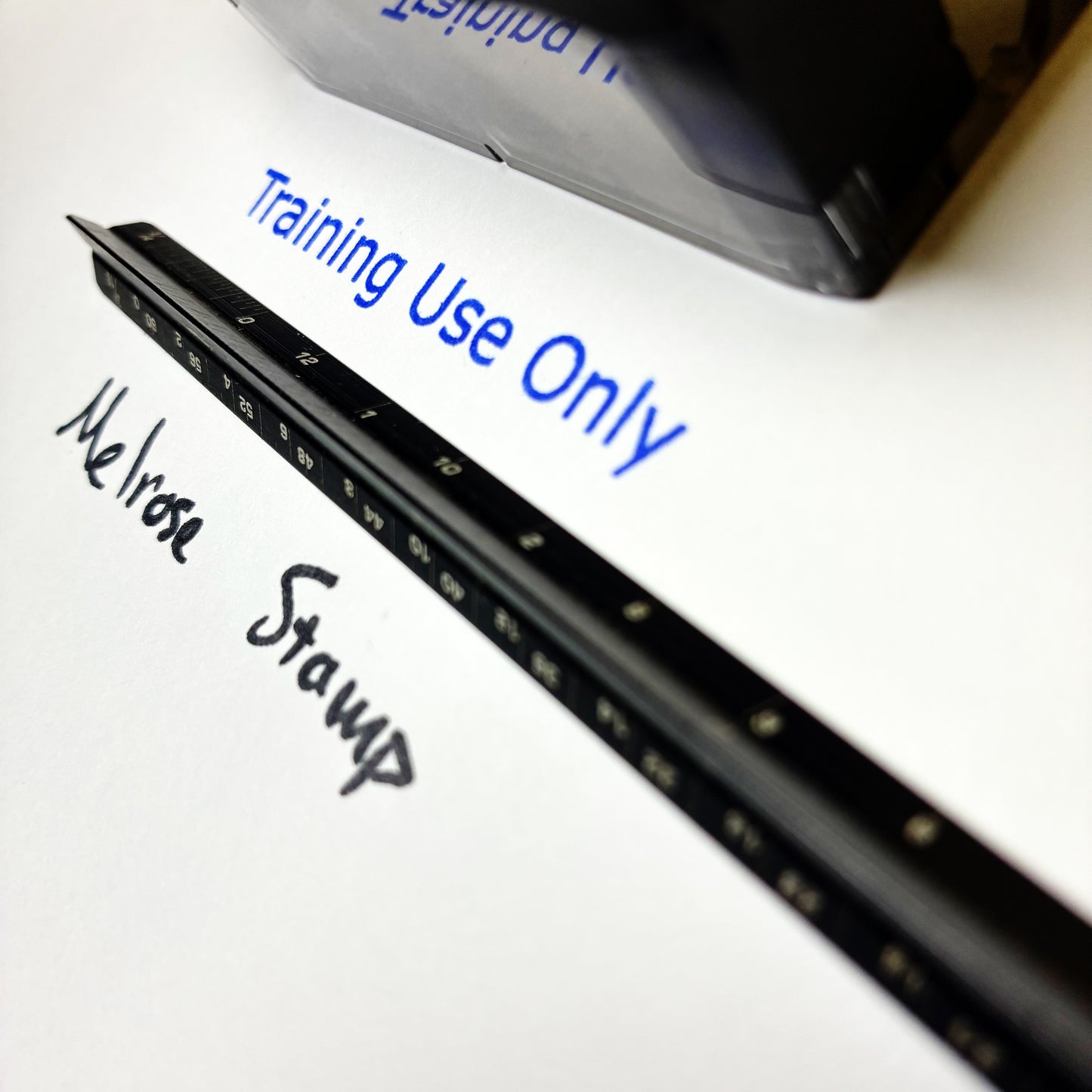 Black stamp with 'Training Use Only' text on a white background